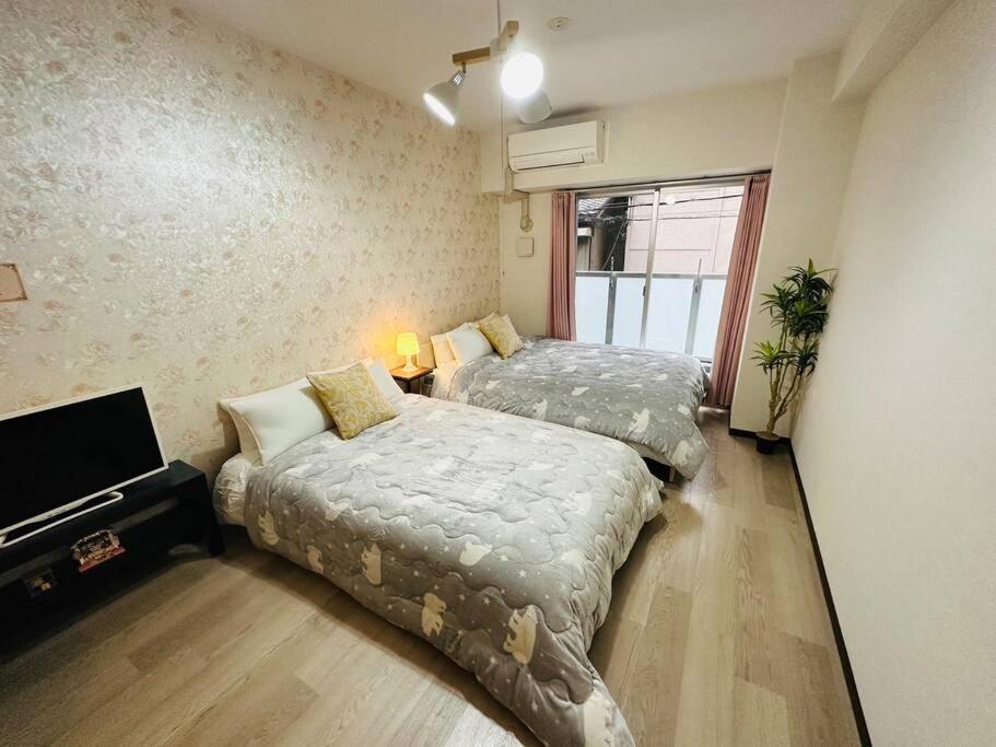 202 黒門市場1分!道頓堀まで徒歩8分!心斎橋まで徒歩9分! Apartment Ōsaka
